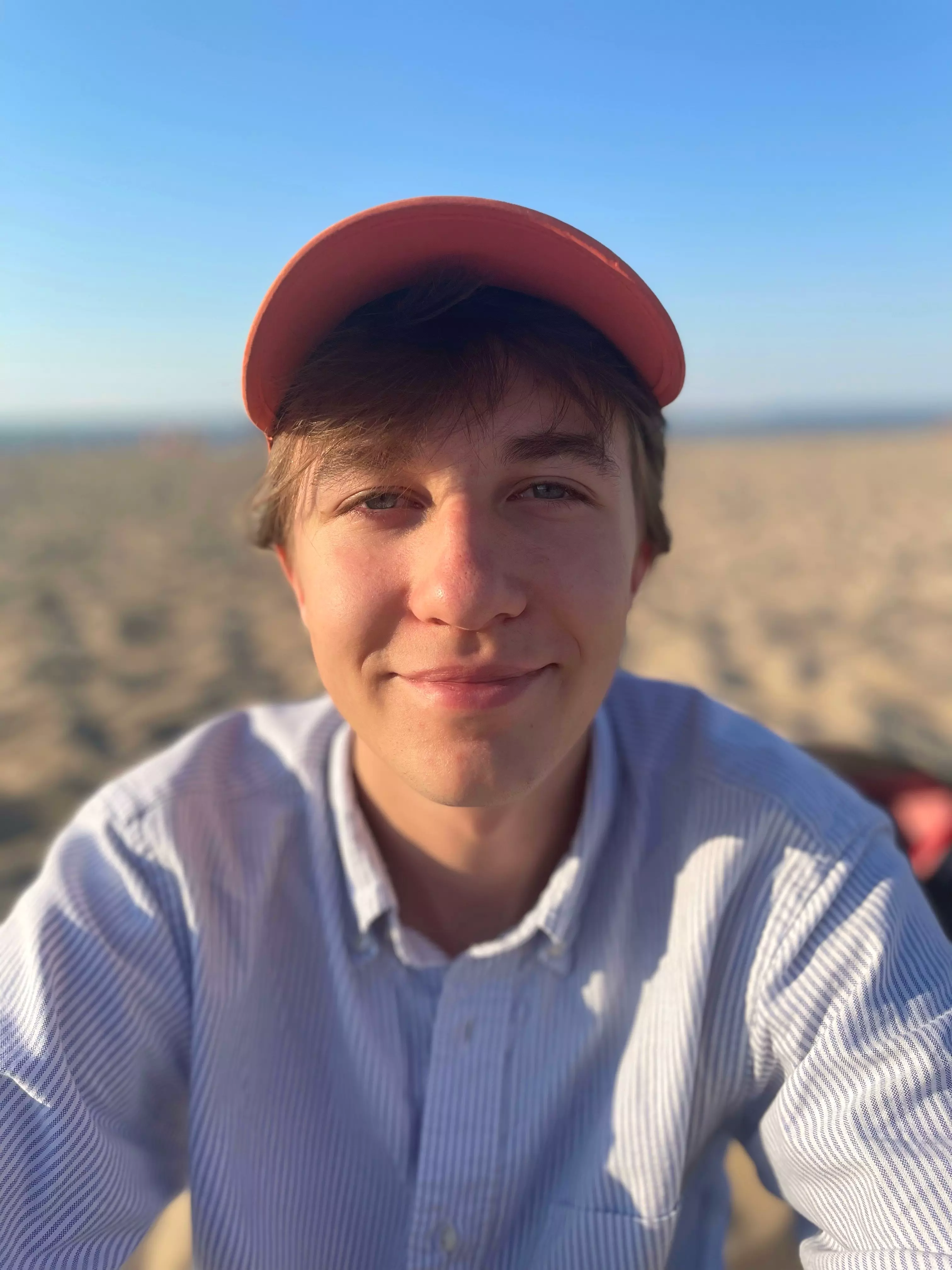 Me at the beach wearing orange cap